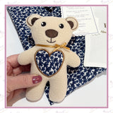 Close up of personalised memorial bear with heart stitched from loved one’s clothing