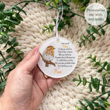 Hand holding a personalised acrylic robin remembrance bauble printed with the poem “I am a special Robin…” – memorial keepsake ornament personalised with any name, featuring a robin symbol of loved ones near.
