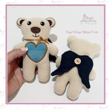 Always With You memorial bear with blue heart made from loved one's clothing and optional navy angel wings shown on the back.