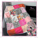 Handmade patchwork memory blanket created from a loved one's ladies' clothing, featuring colourful fabric squares and a soft anti-pill fleece backing to create a personalised keepsake blanket.