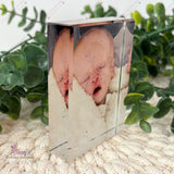 Angled side view of a personalised portrait crystal photo block showing its clear edges