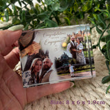 Small personalised crystal photo block held in a hand, measuring 8 x 6 x 1.9cm
