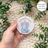 Blue angel wings candle acrylic bauble with the name Dad, personalised memorial ornament handmade by Loveable Keepsakes UK.