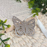 Close up of silver plated stainless steel butterfly bookmark with white tassel detail, memorial sympathy gift.