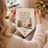 Personalised robin memorial pennant with Dad personalisation, held in a cosy Christmas setting to show the size and design.