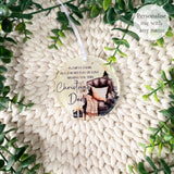 Personalised acrylic “Empty Chair” bauble with Dad presented inside a white gift box and surrounded by greenery.