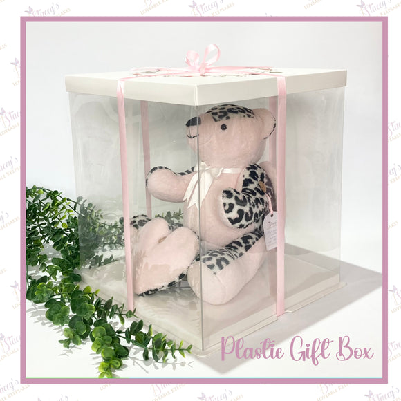 Regular jointed memory bear displayed inside a transparent 30cm plastic gift box with pink ribbon and decorative lid.