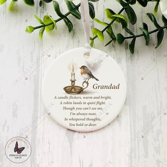 Personalised ceramic memorial bauble featuring robin, candle, and angel wings design, with the name Grandad.