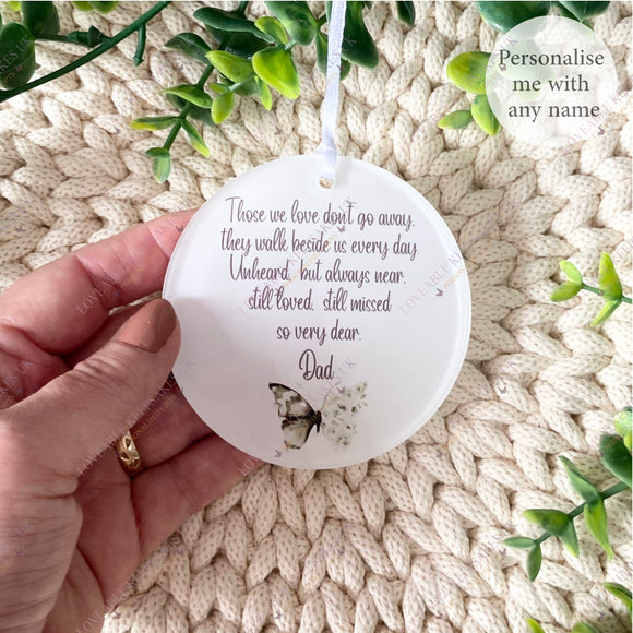Hand holding a personalised acrylic remembrance bauble with green butterfly design and the words “Those we love don’t go away…” printed on it – memorial ornament for Dad, personalised with any name.