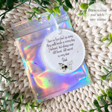 Personalised green butterfly remembrance bauble shown inside holographic gift pouch – acrylic memorial ornament with “Those we love don’t go away” quote.