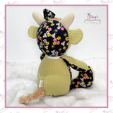 Rear view of a handmade Memory Highland Cow Keepsake created from loved one's clothing, showing the back design, fluffy tail and carefully handcrafted details.