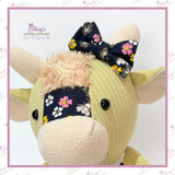 Close-up of a handmade Memory Highland Cow Keepsake made from loved one's clothing, showing the beautifully handcrafted face, fluffy fringe and signature Highland Cow details.