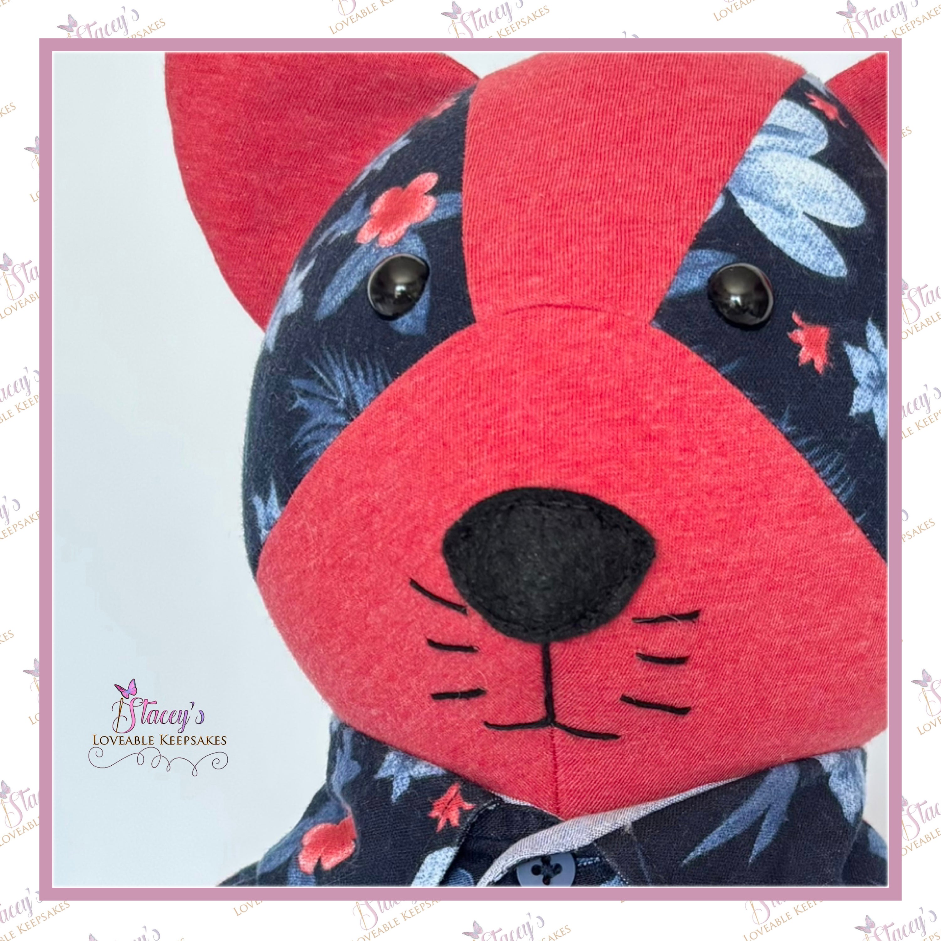 Close-up of personalised memory cat face handmade from loved one's clothing.