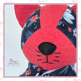 Close-up of personalised memory cat face handmade from loved one's clothing.
