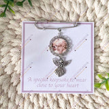 Photo angel brooch displayed on keepsake card with message “A special keepsake to wear close to your heart.