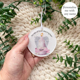 Pink angel wings candle acrylic bauble with the name Mum, remembrance keepsake handmade in the UK by Loveable Keepsakes.