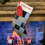 Memory patchwork Christmas stocking hanging by cosy log fire, made from loved one’s clothes and personalised with name and embroidered poem tag.