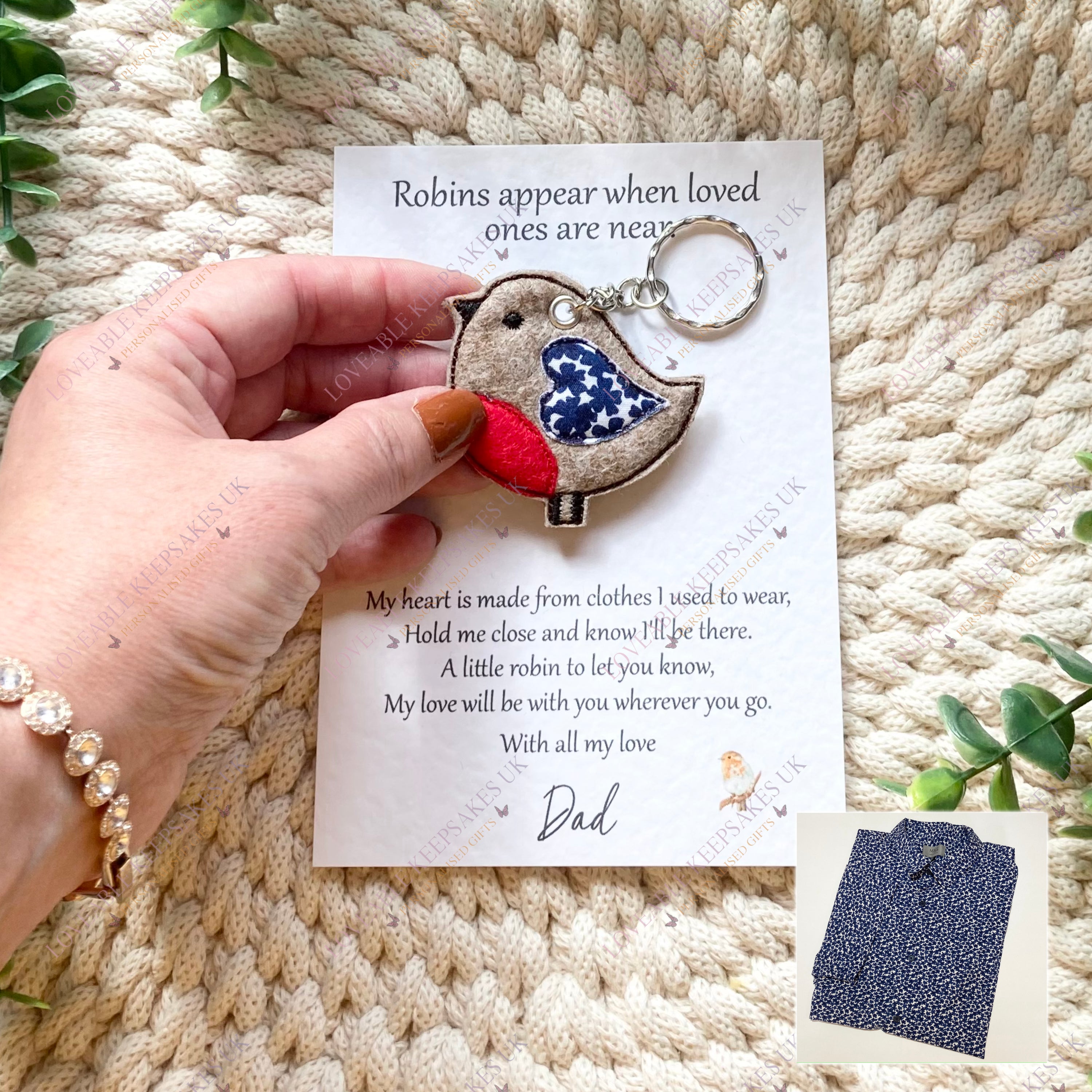 Hand holding robin memorial keyring on personalised card, remembrance keepsake.