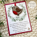 Greeting card with a robin design and text on a textured surface