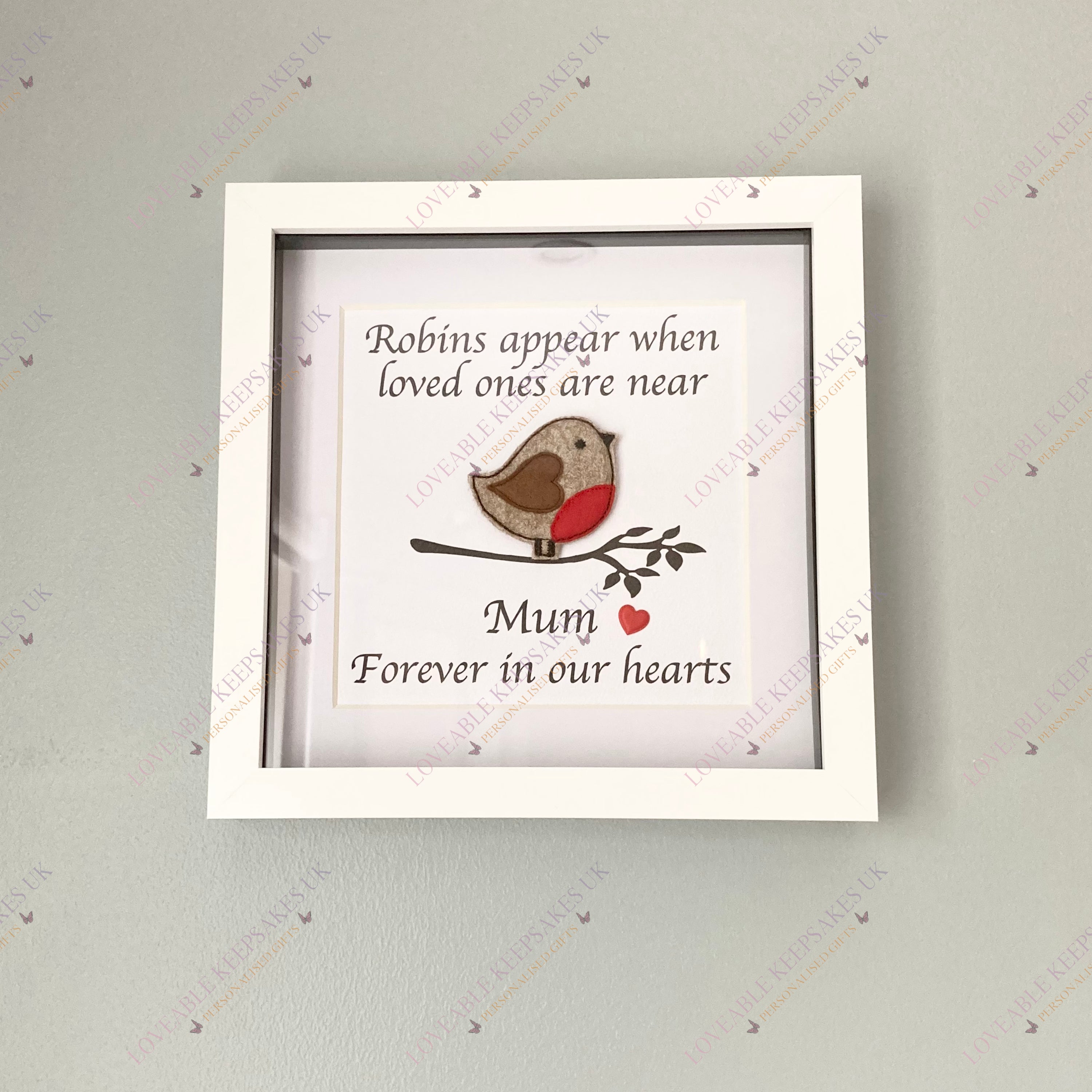Personalised robin memorial box frame hanging on wall, featuring 3D embroidered felt robin, red heart, and custom name – elegant remembrance home décor.