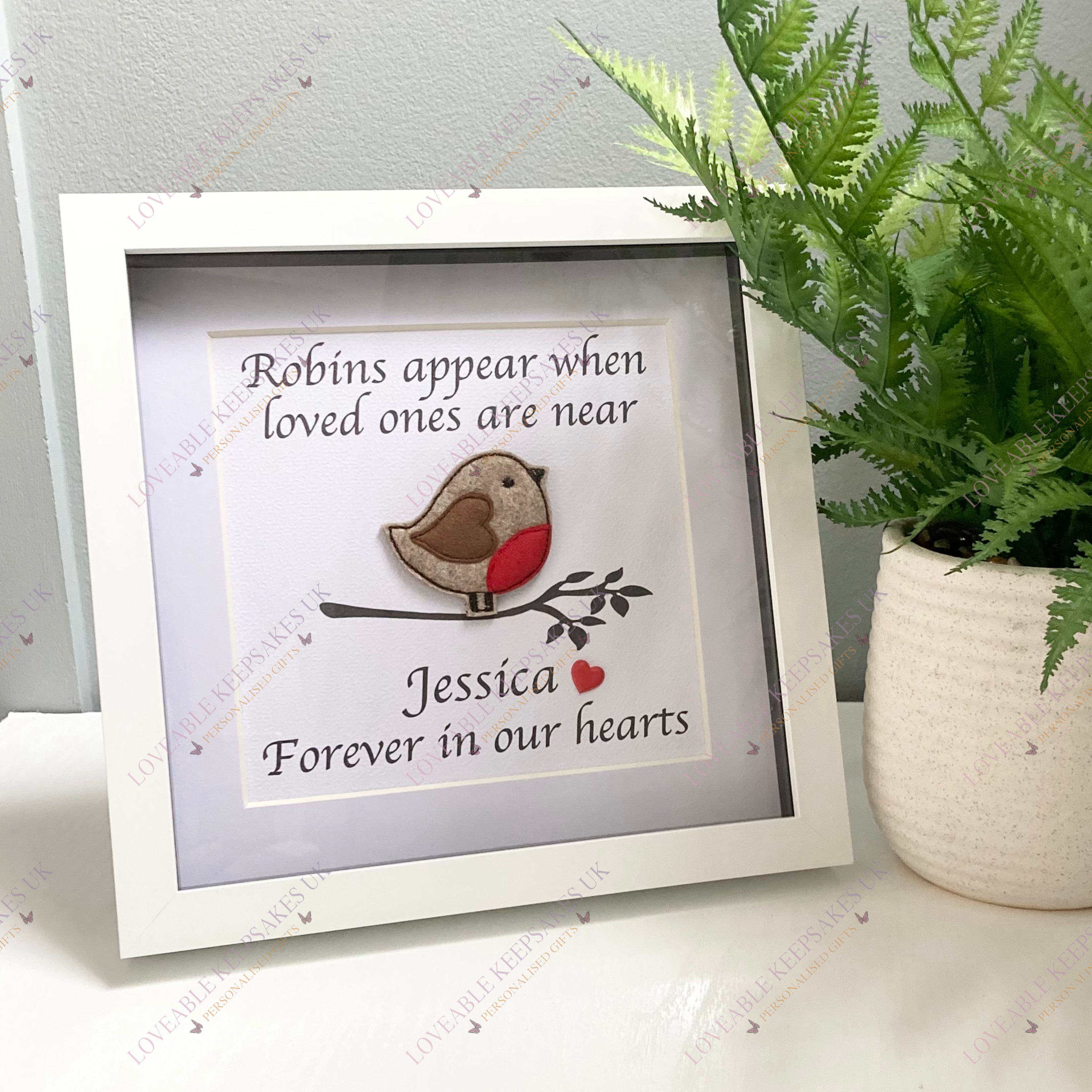 Customised robin memorial frame example with the name Jessica beneath the embroidered robin.
