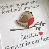 Angled display of robin remembrance box frame showing 3D bird and luxury white mount with glass cover.