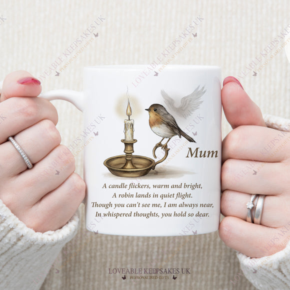 Personalised white remembrance mug with robin, candle, and angel wings design, featuring the name Mum and touching memorial poem.