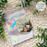 showing the “Empty Chair” bauble in a holographic gift pouch,