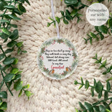 Acrylic remembrance bauble with robin wreath design and memorial verse, personalised Grandad, shown on a knitted background with greenery.