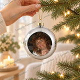 Personalised silver photo bauble with loved one’s photograph displayed on a Christmas tree