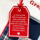 Close-up of embroidered poem tag on memory patchwork stocking reading ‘A stocking made with love and grace…’, a touching Christmas remembrance detail.