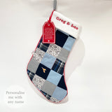 Personalised patchwork memory Christmas stocking handmade from loved one’s clothes, shown with name embroidery and poem tag.
