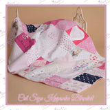 Handmade cot size memory blanket created from precious baby clothes, transformed into a personalised keepsake blanket with soft anti-pill fleece backing.