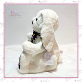Side profile of the seated memory bunny showing its pear-shaped body, long ears and curved jointed legs.