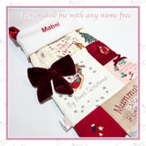 Close up of personalised Christmas stocking with child’s name embroidered on white fleece cuff